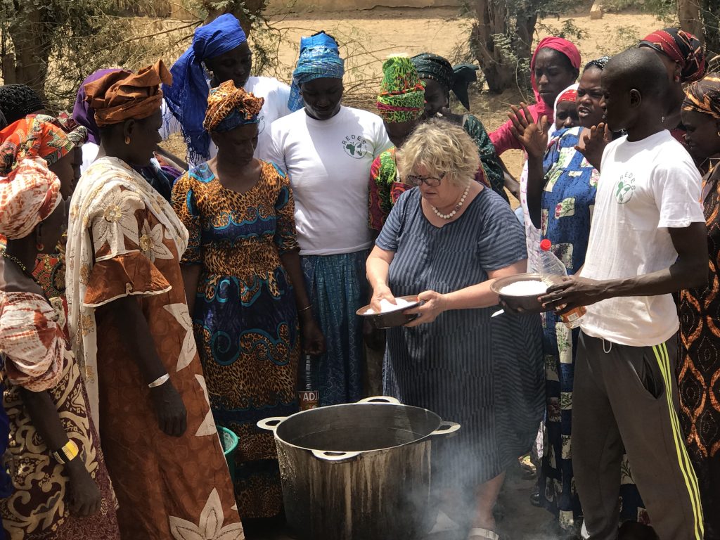 Pellicano cooking with people form the community of Guédé Chantier, Senegal